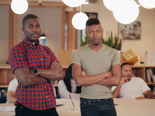 Photo of Men with Arms Crossed