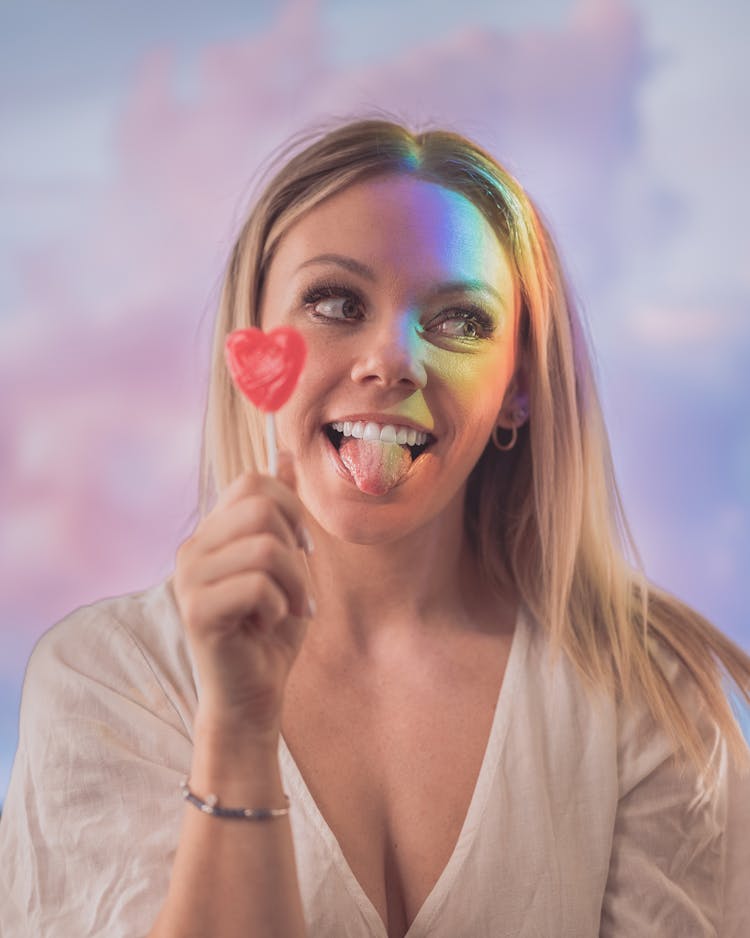 Young Provocative Woman With Lollipop And Tongue Out