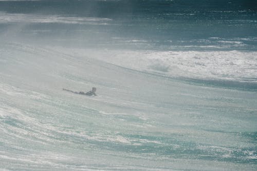Person Surfing on a Big Wave 