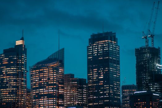A captivating view of illuminated skyscrapers in an urban setting at night, showcasing architectural beauty.