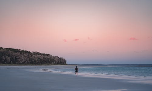 Man Running on Beach at Dawn