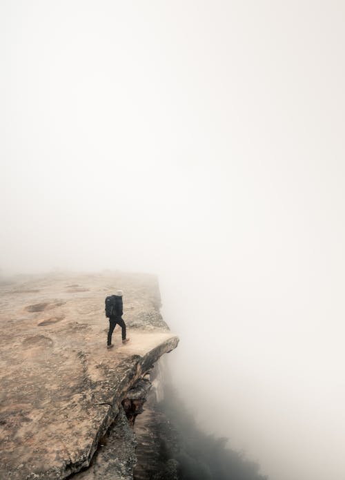 A Person Standing on Rock Formation