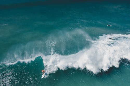 A Person Surfing on Sea Waves