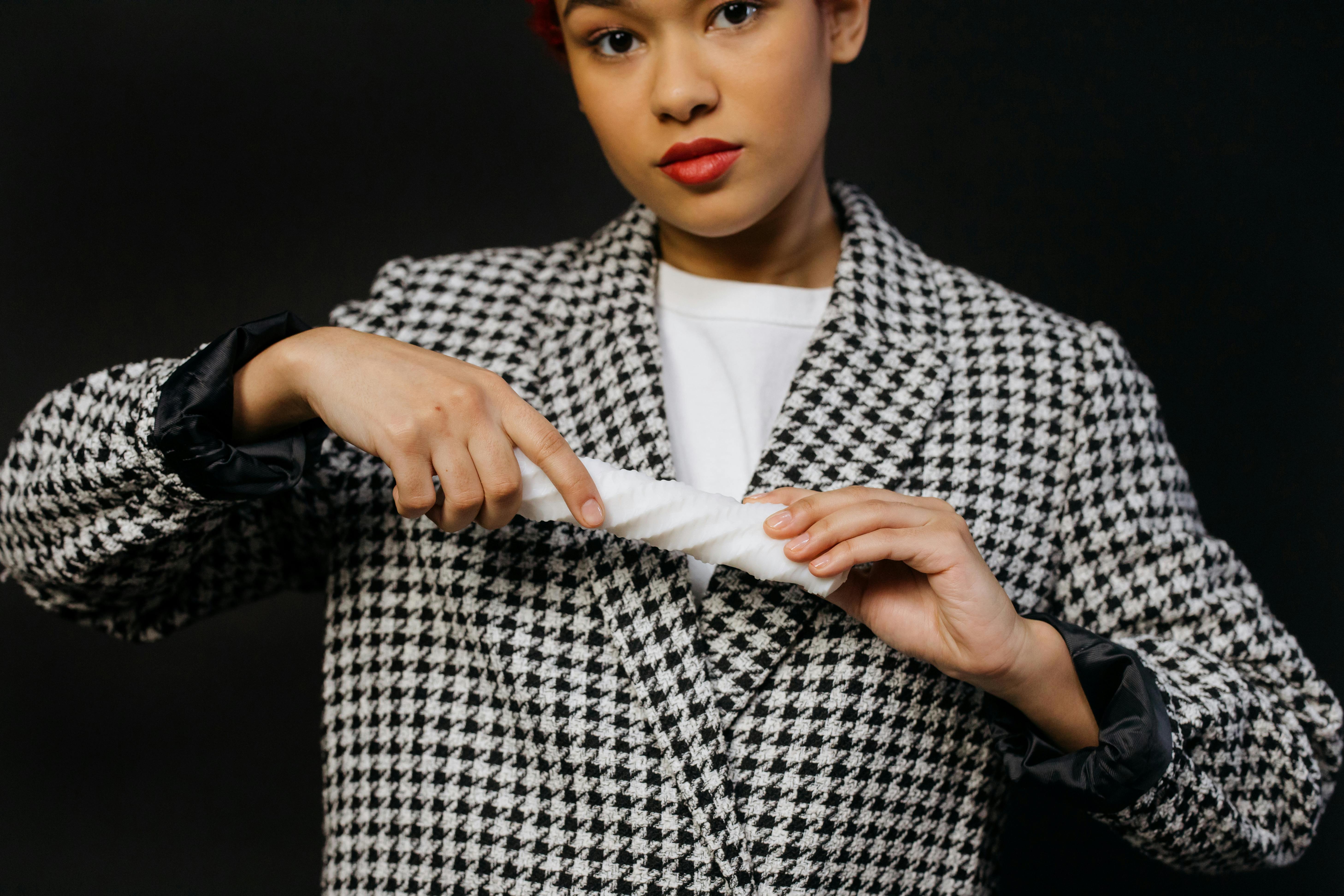 a woman holding a white object