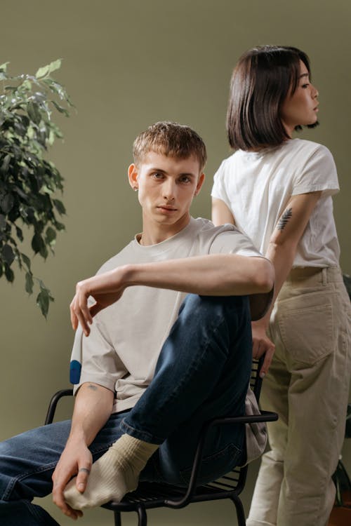 Stylish Young Man and Woman in Plain Shirts 