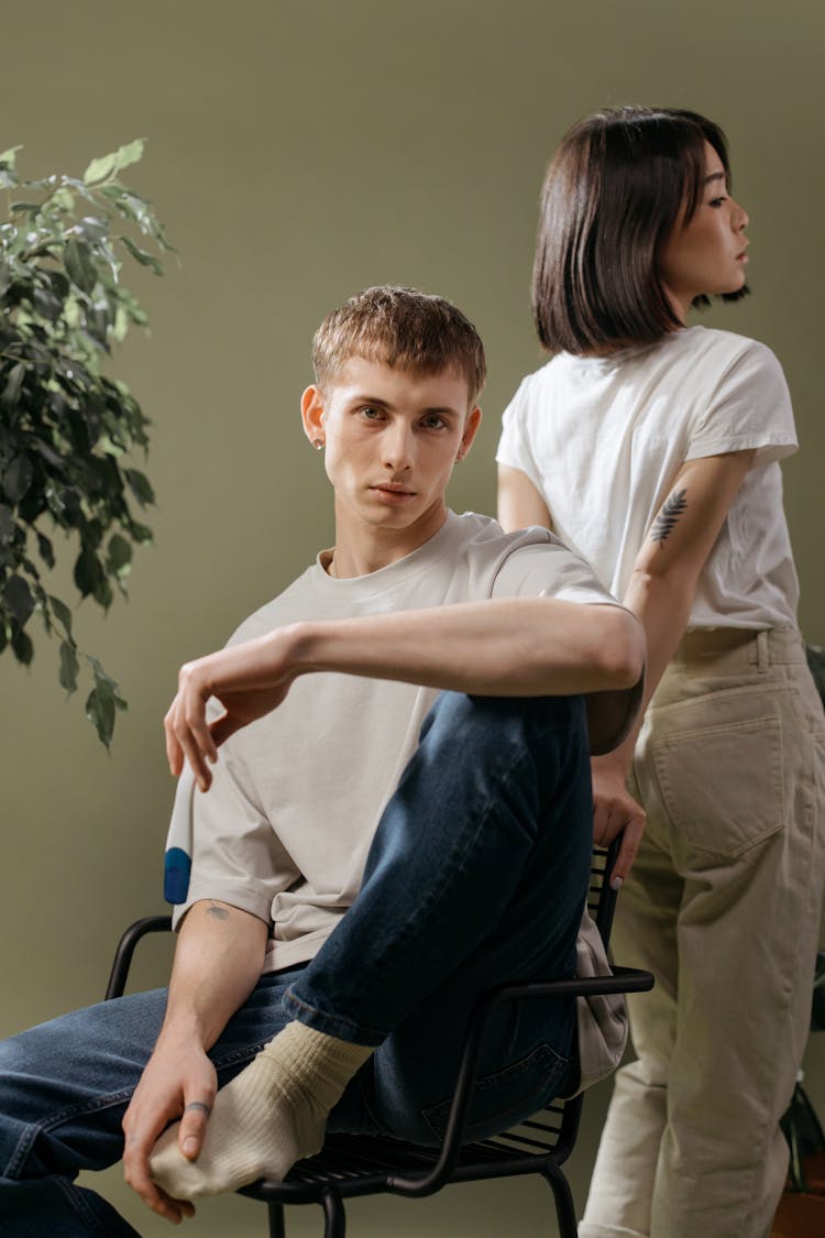 Stylish Young Man And Woman In Plain Shirts 