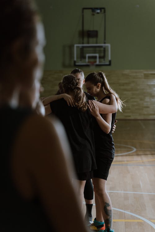 Group of People inside Basketball Court