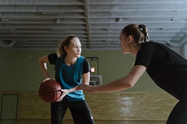 Two guards competing in an indoor basketball game — cottonbro studio on Pexels