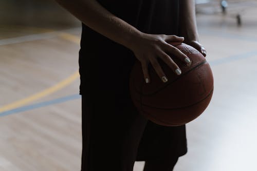 Free Person Holding a Basketball Stock Photo