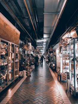 A lively indoor market with diverse stalls and shoppers enhancing a vibrant shopping experience.