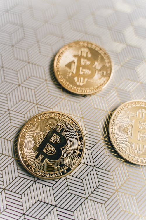 Golden Bitcoins in Close Up Photography