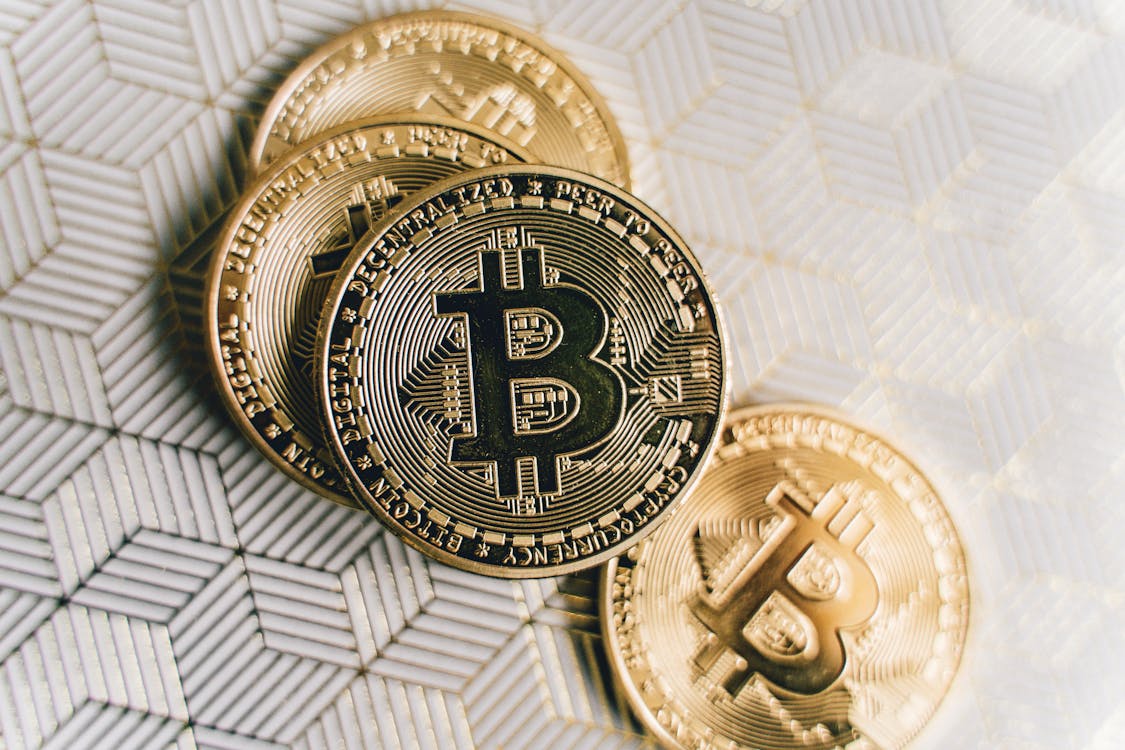 Free Close Up Photo of Four Bitcoins Stock Photo