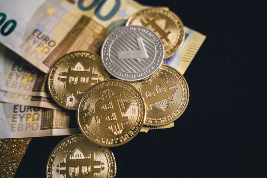 Close-up of bitcoins and euro banknotes, representing modern finance and digital currency exchange.