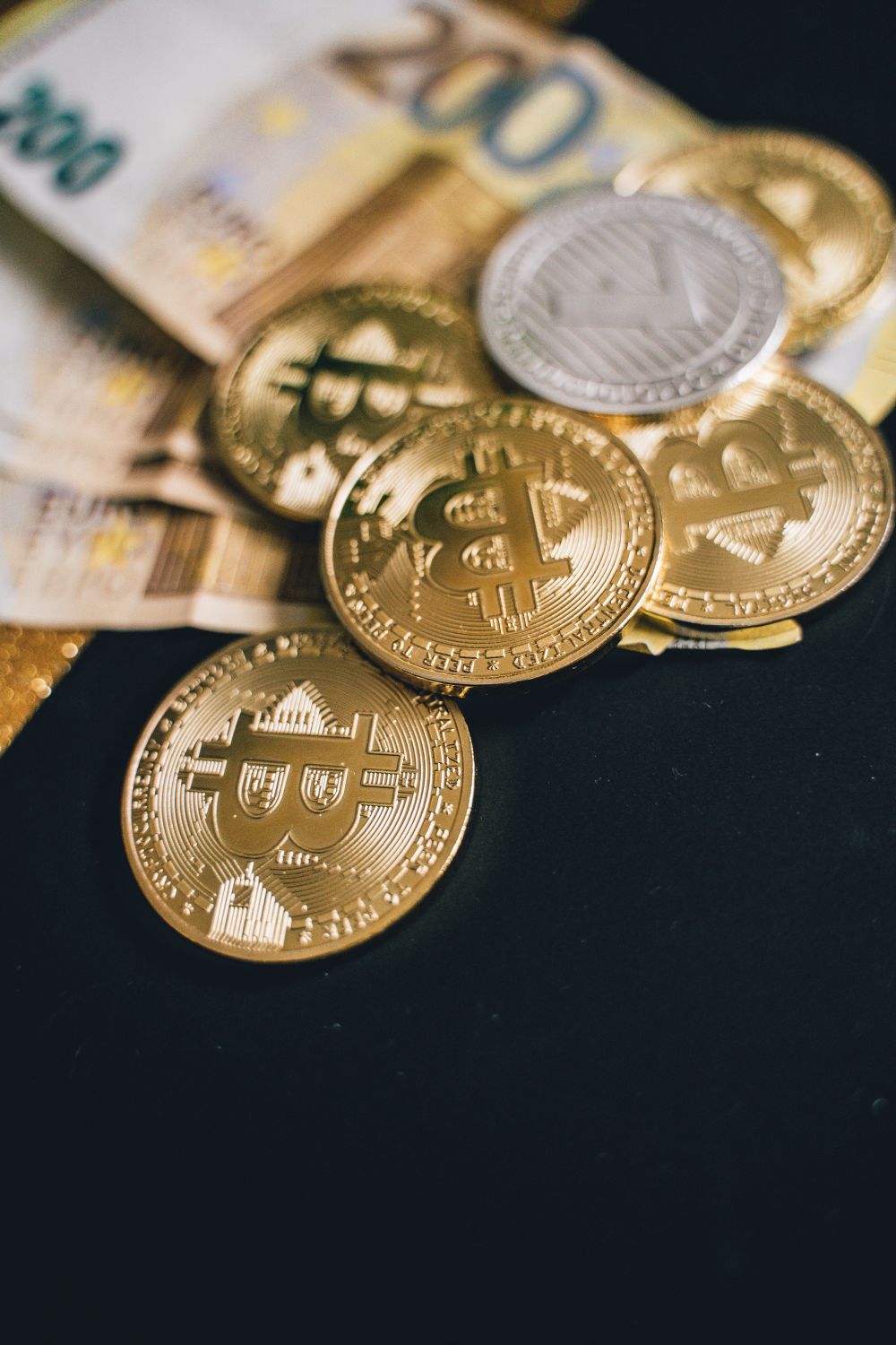Close-Up Shot of Coins and Bills · Free Stock Photo
