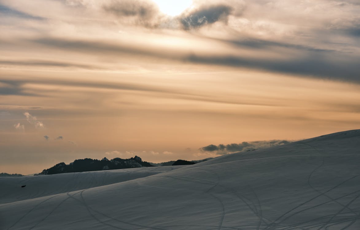 Natural Landscape with Gray Sand during Sunset