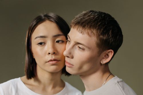 Free Close-up portrait of a thoughtful couple with an intimate connection. Stock Photo