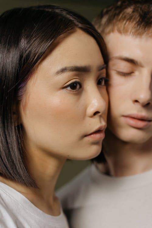Close Up Photo of Couple's Faces