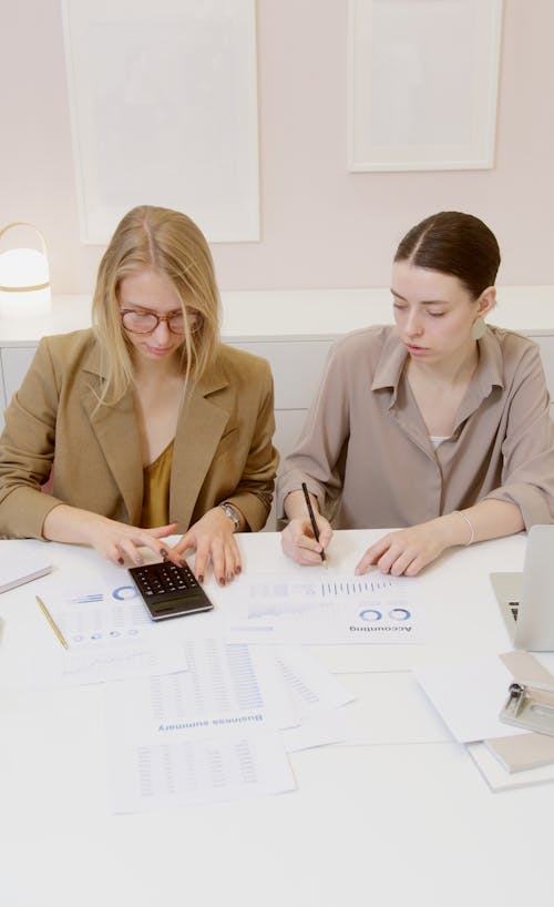 Free Women Working Together at the Office Stock Photo