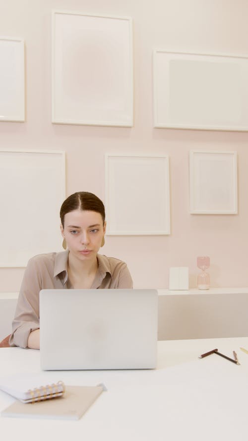Free Beautiful Woman Using a Laptop Computer Stock Photo
