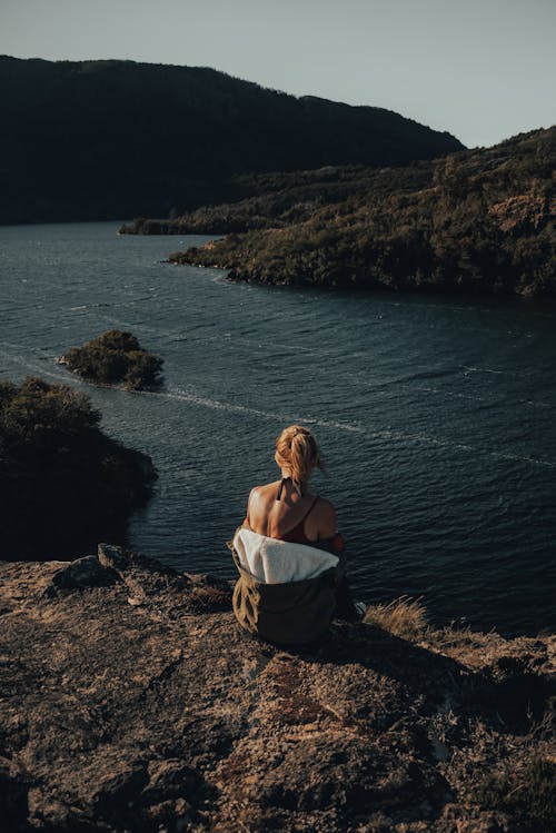 A Woman Sitting on the Rock 