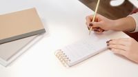 Hands writing in a spiral notebook, photo by Artem Podrez on Pexels