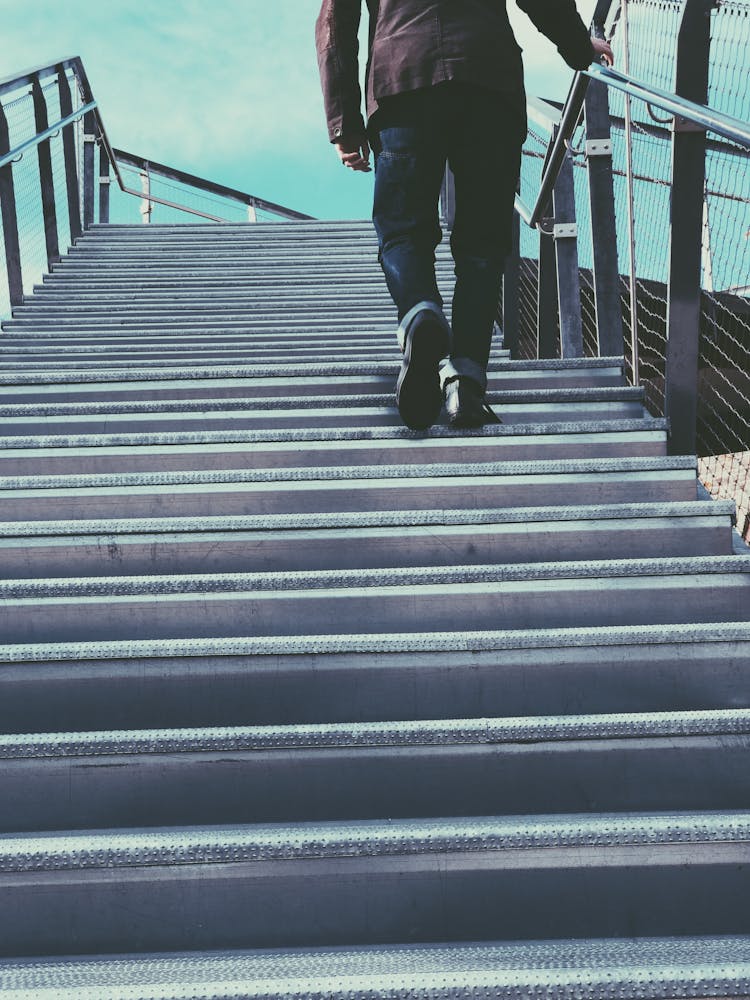 Man Walking On Gray Stairs