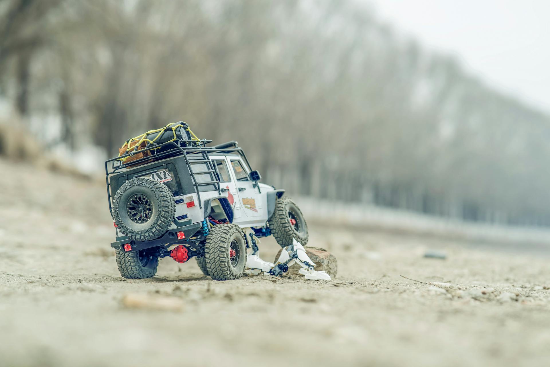 Remote controlled 4x4 toy car exploring rugged off-road terrain. Perfect for hobbyists and RC enthusiasts.