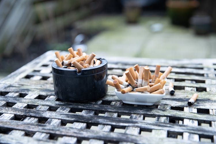 Lots Of Cigarette Butts In Ashtrays