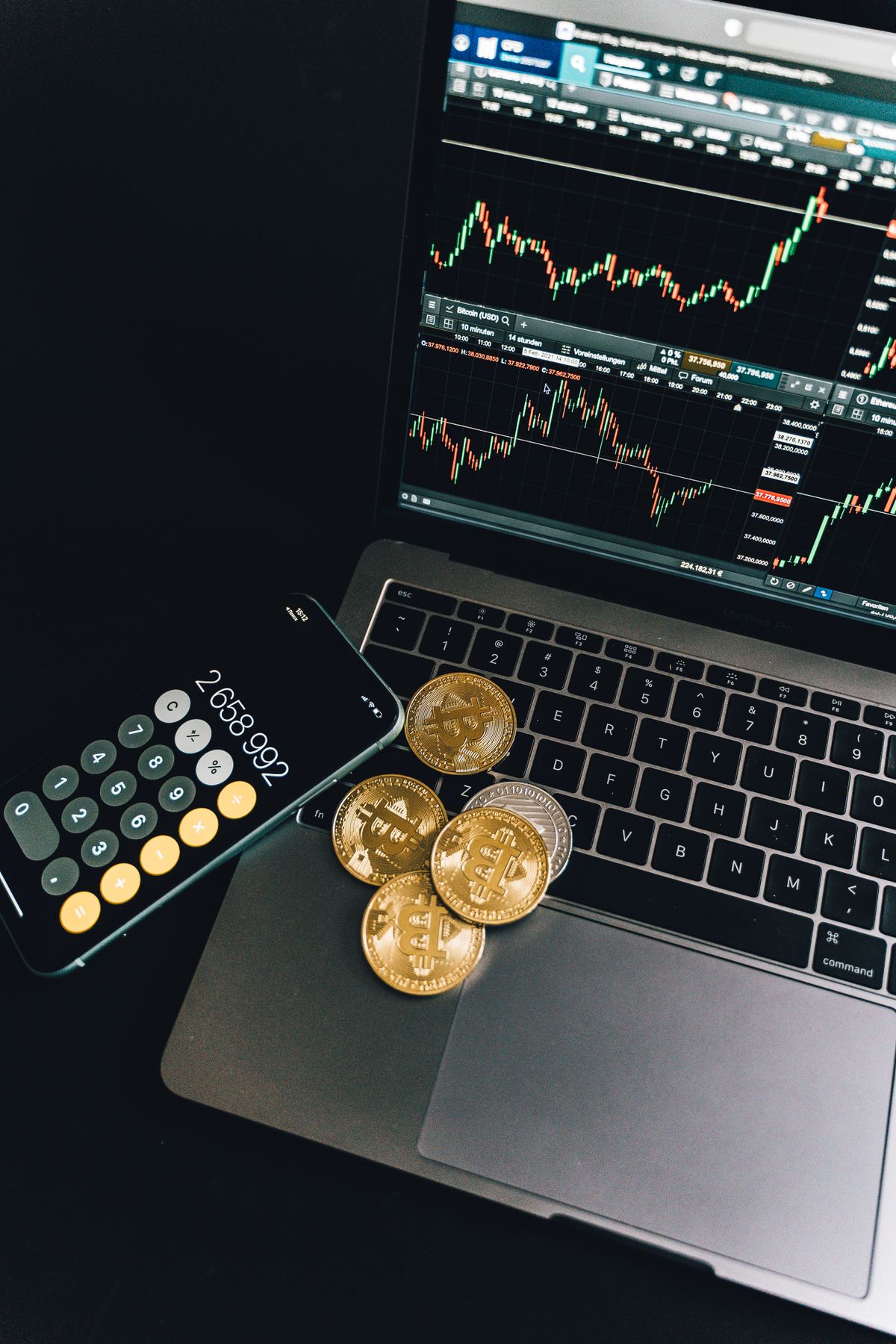 Smartphone displaying a growing financial chart with crypto coins in the background