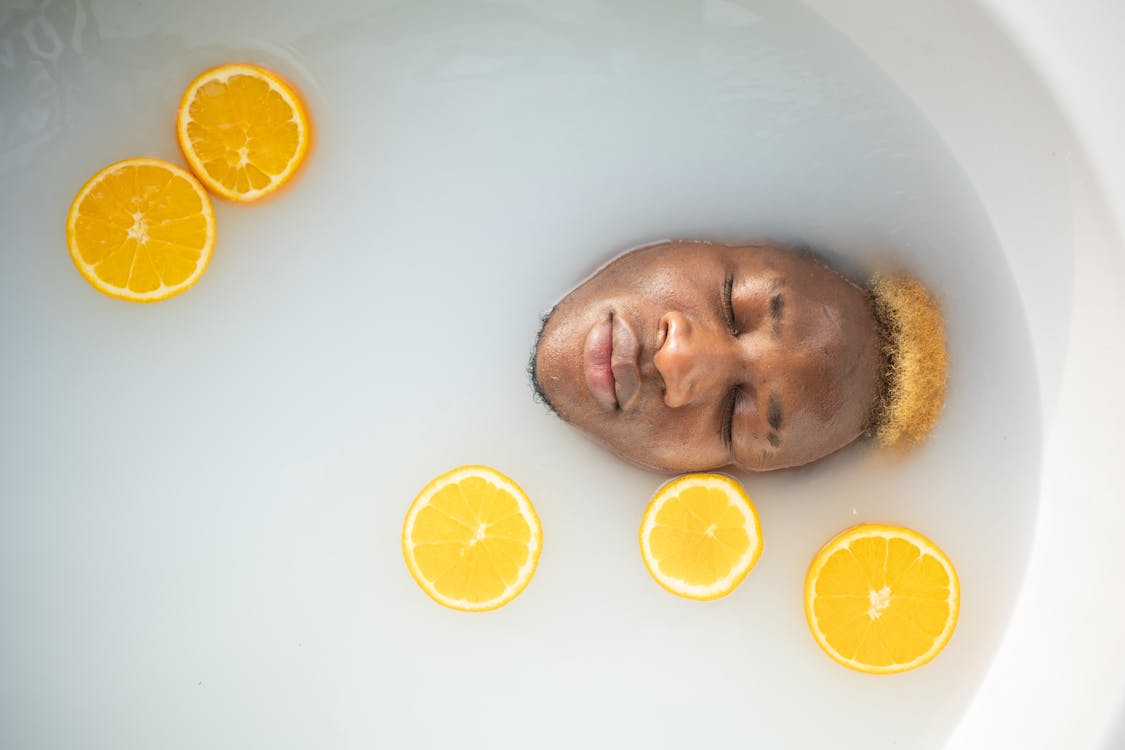 Black man immersed in bathtub