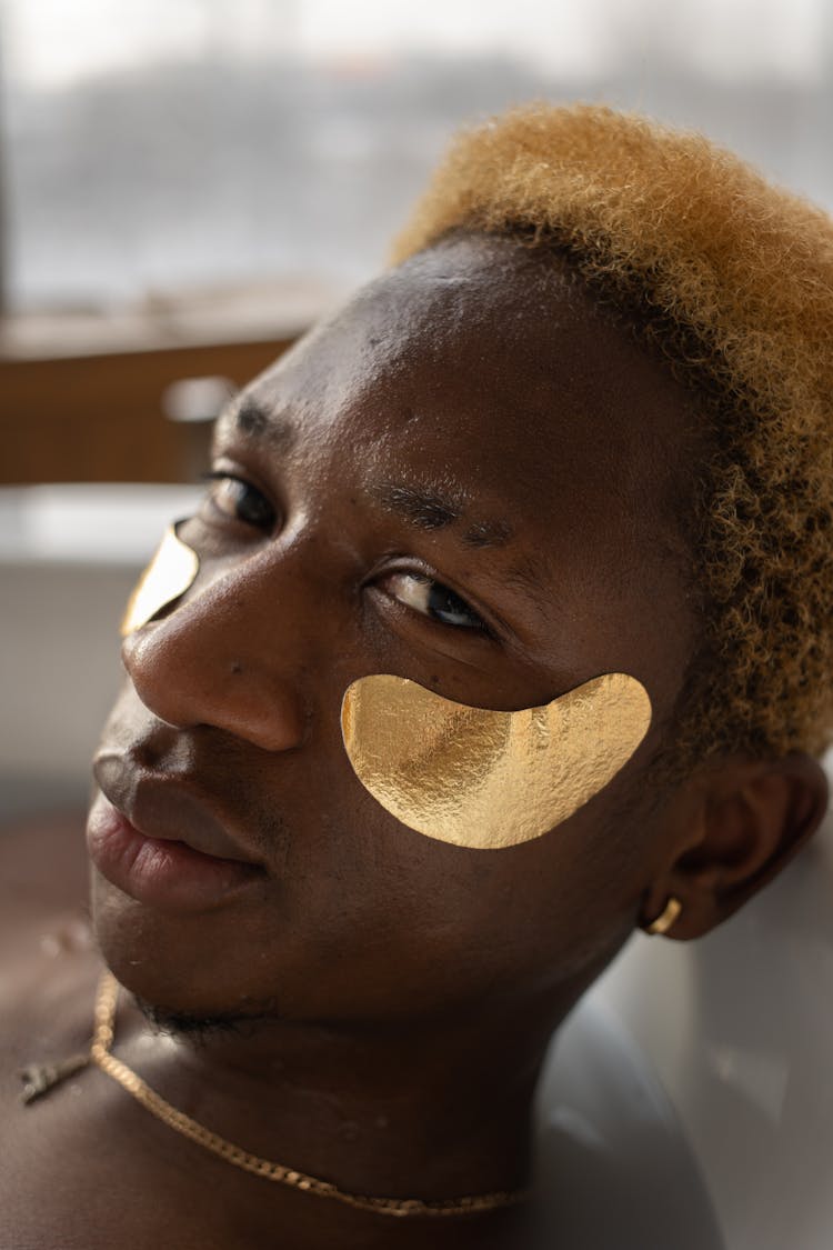 Calm Black Man With Eye Patches In Tub