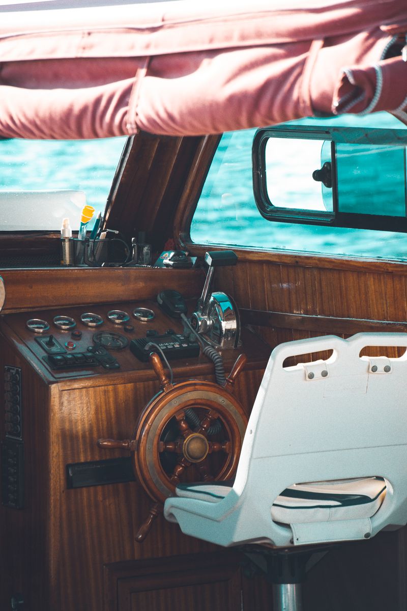 Yacht helm with steering wheel and lever controls