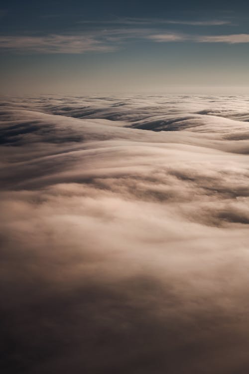 Foto stok gratis awan, bentangan awan, di atas awan