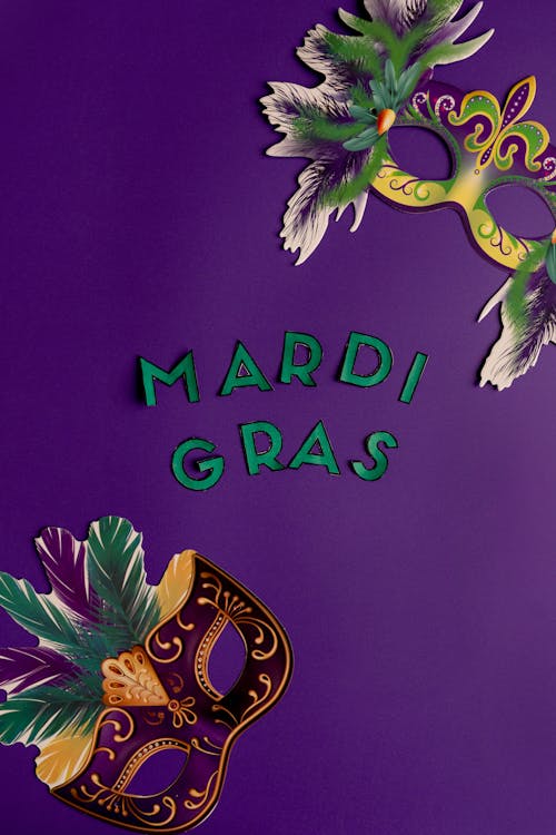 Colorful Masks And Mardi Gras Text On Purple Back