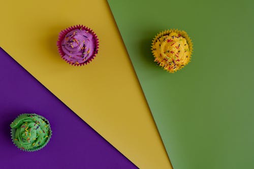 Colored Cupcakes In Colorful Background