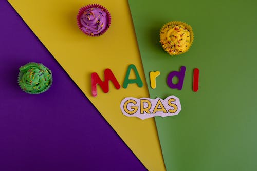 Free Mardi Gras Text And Cupcakes On Colorful Background Stock Photo