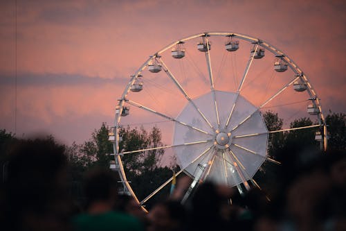Free A White Ferris Wheel during Sunset Stock Photo