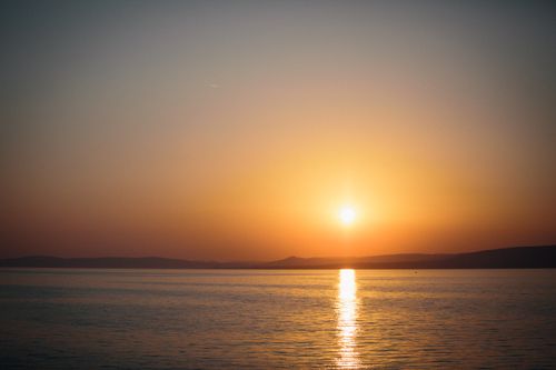 Free Captivating sunset view over Lake Balaton in Hungary, radiating warmth and tranquility. Stock Photo