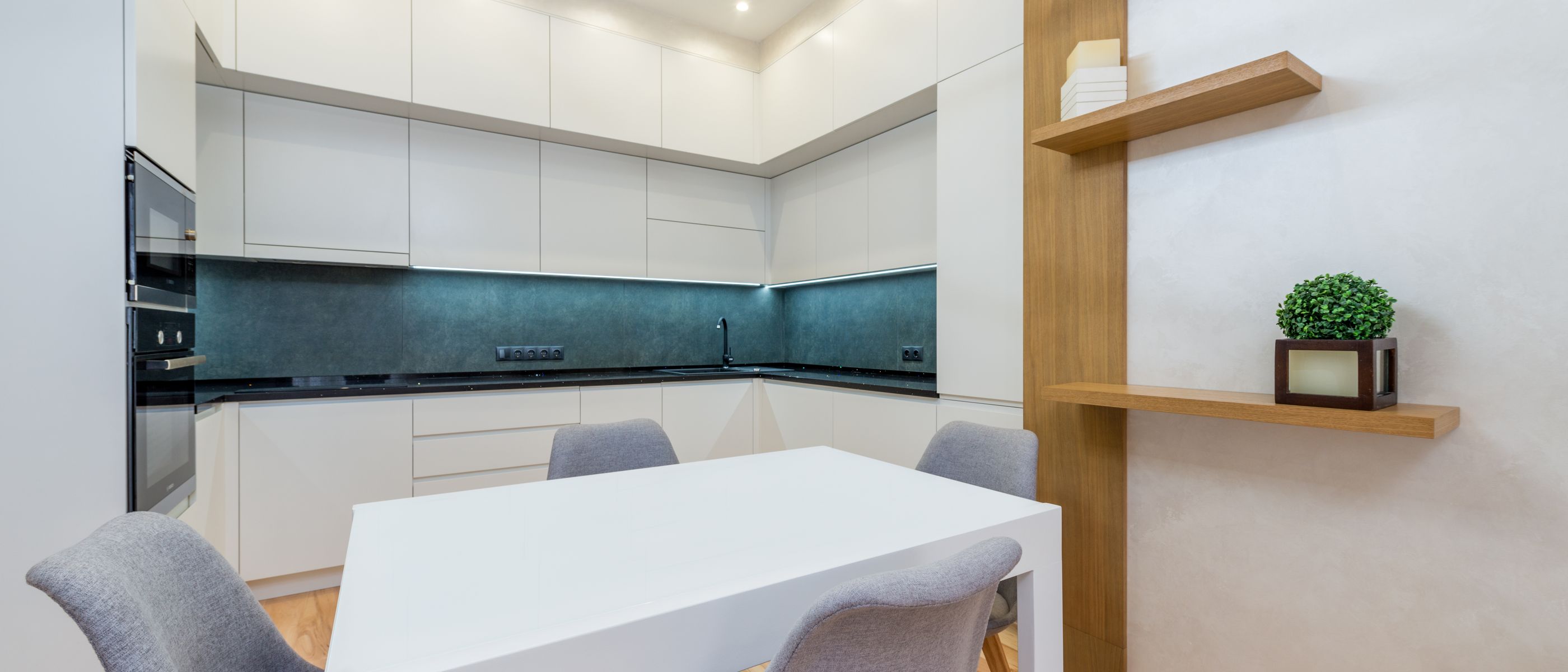 Kitchen Spraying in Colindale — clean edges cut in around trim and sockets