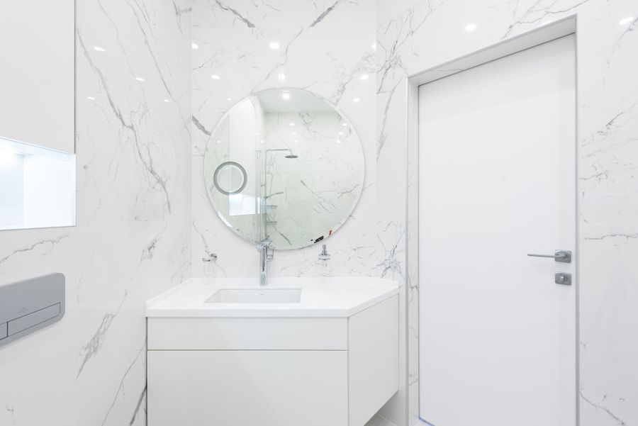Bathroom vanity with a custom-fit wall mirror