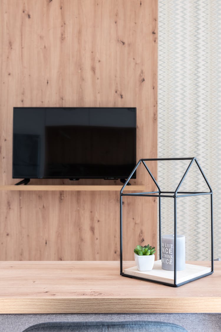 Room With Table With Decorations Near TV