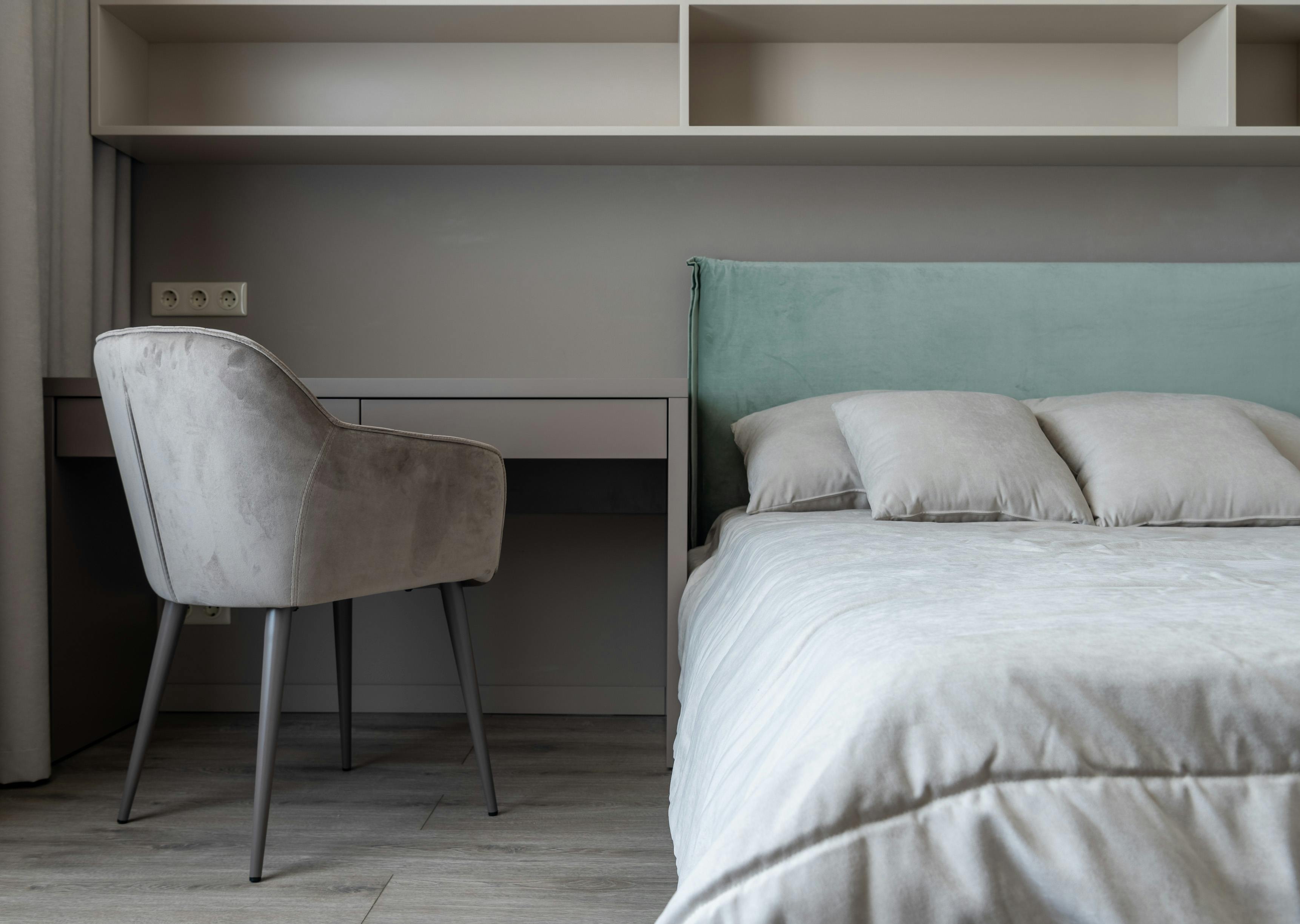 Apartment interior with bed near table with chair · Free Stock Photo