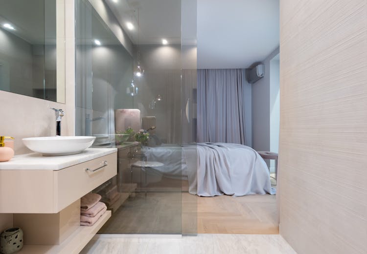 Washroom With Sink And Tap On Counter Near Bedroom