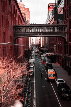 Aerial view of New York City's urban street with the famous High Line footbridge.