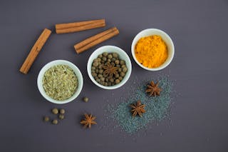 Assorted Spices Near White Ceramic Bowls