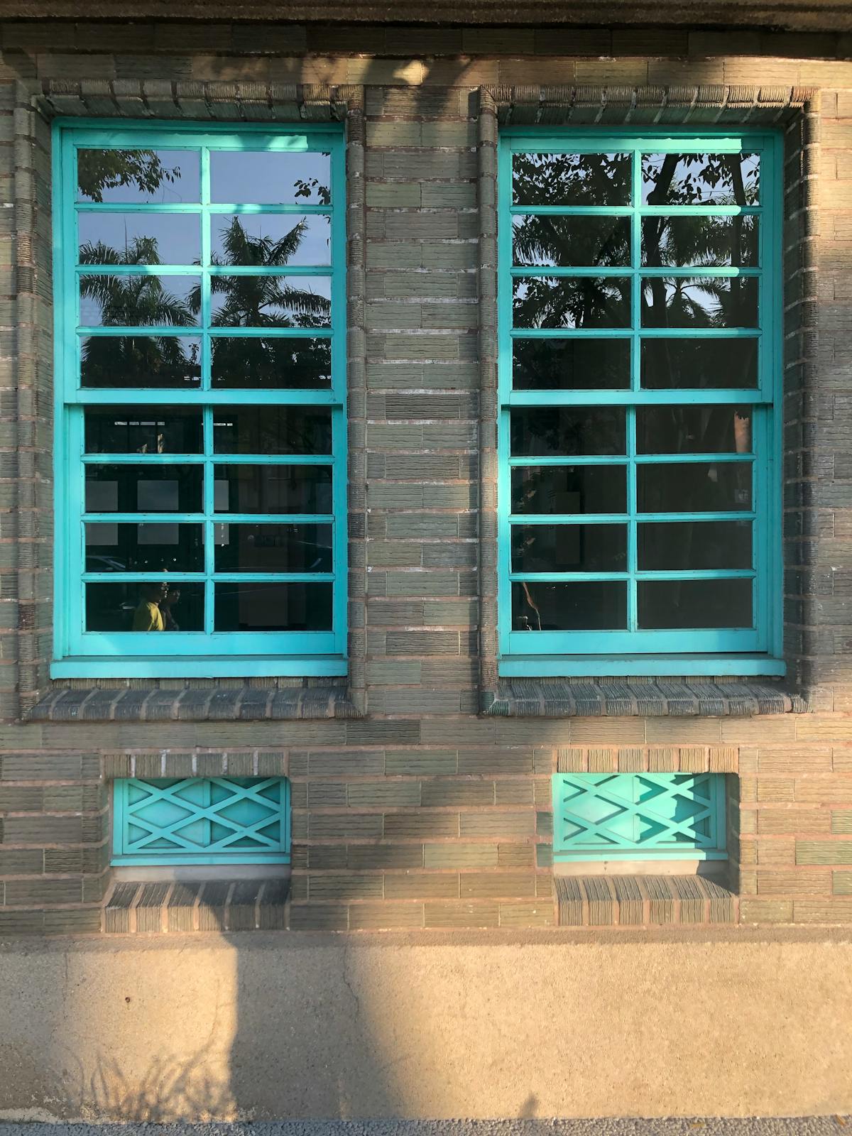 Olive oil bottle fitted with a metal pour spout on a kitchen counter