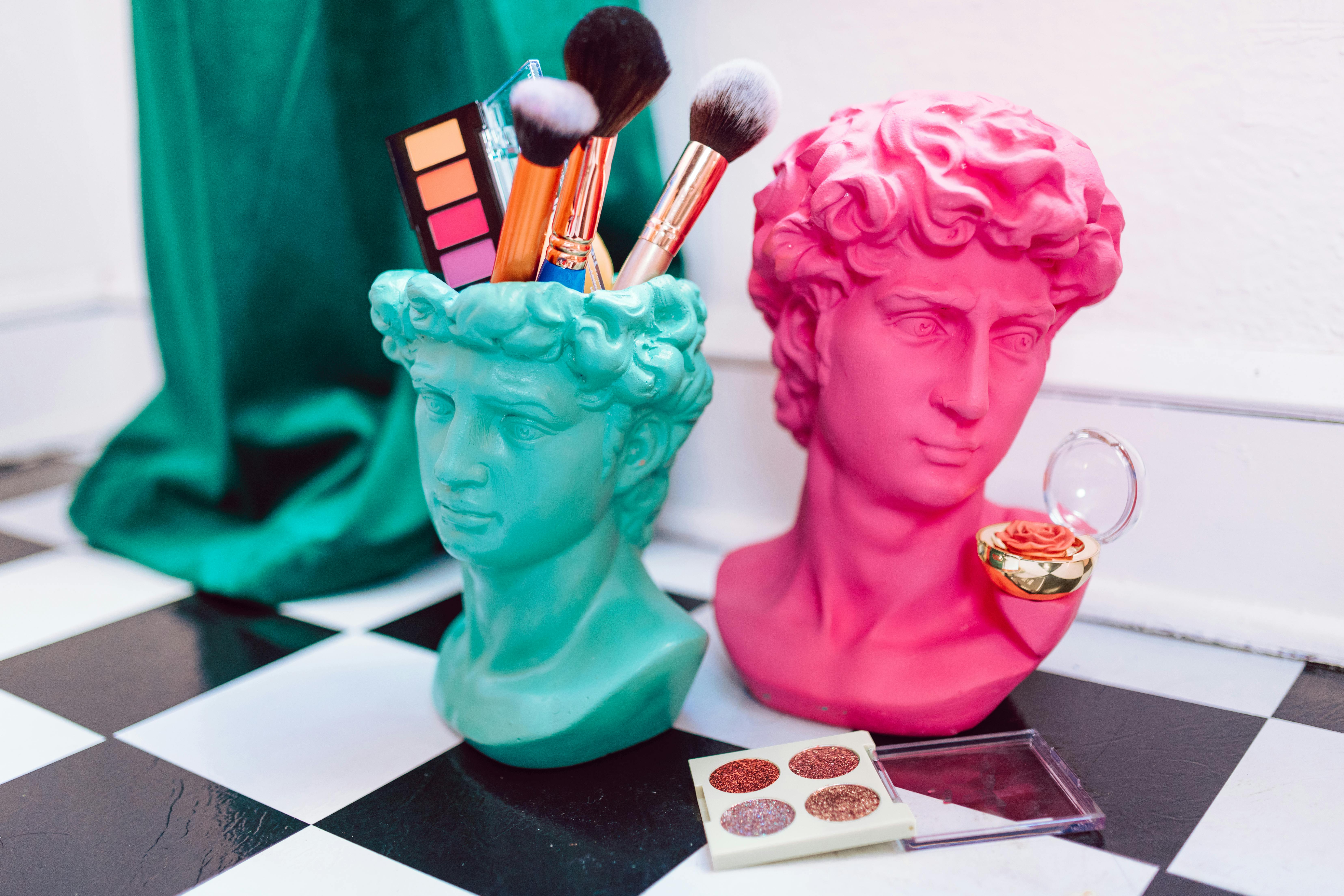Makeup Brushes in Bust Sculpture Holder · Free Stock Photo