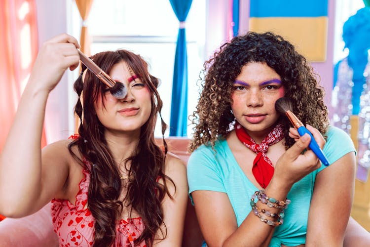 Woman In Pink And Red Tank Top Holding Makeup Brush