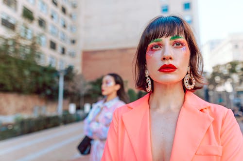 Woman in Orange Blazer Looking Afar 