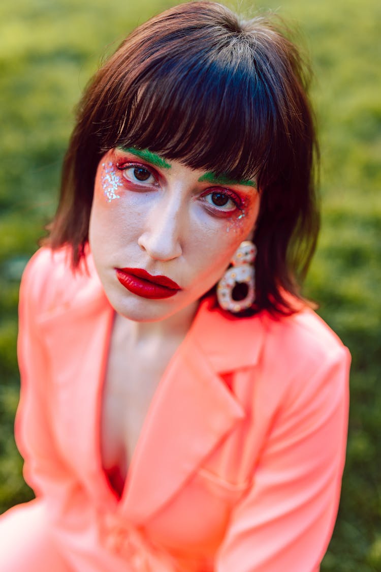 Stylish Woman With Orange Eyeshadow And Red Lipstick 